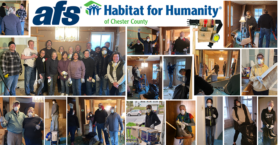 Employees gutting a house for Habitat for Humanity